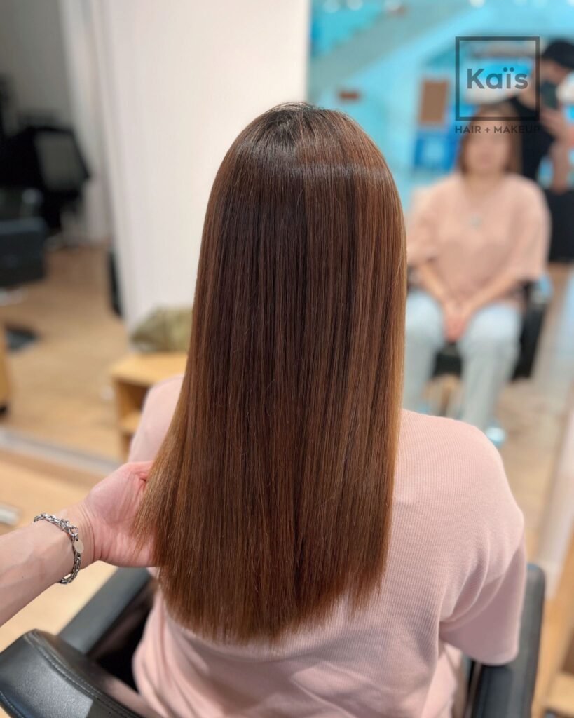 Sleek, shiny hair after Japanese hair straightening by Kaiis Hair Salon Vancouver